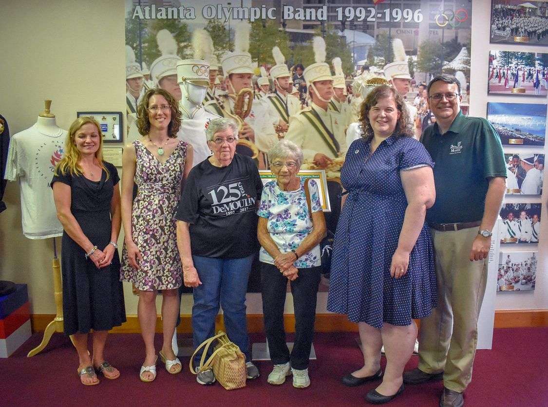 AOB band members Christy Casher, Lynne Snyder and Jill Sewell with DeMoulin employees Grace Haynes and Frances Ulmer, and DeMoulin Museum Curator John Goldsmith. (photo by Cera Douglas)