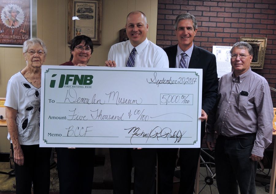 Members of the DeMoulin Museum Board of Directors participated in the check presentation