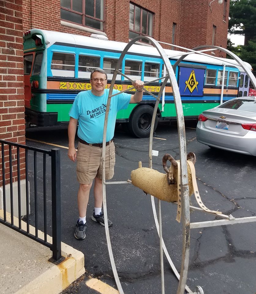 Museum curator with the Ferris Wheel Coaster Goat outside the Masonic Lodge.