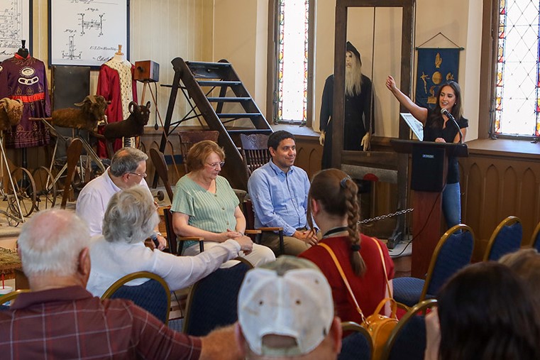 Josh Torres directed the drumline, provided the uniform and photos for the display and participated in the unveiling and roundtable discussion that also included curator John Goldsmith and DeMoulin retiree Marcia Walker who was a supervisor on the Super Bowl Halftime uniform project.