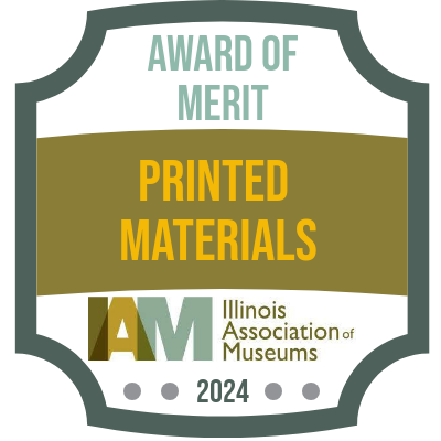 green ribbon and gray circle website badge recognizing Illinois Association of Museum's 2024 Museum Volunteer of the Year