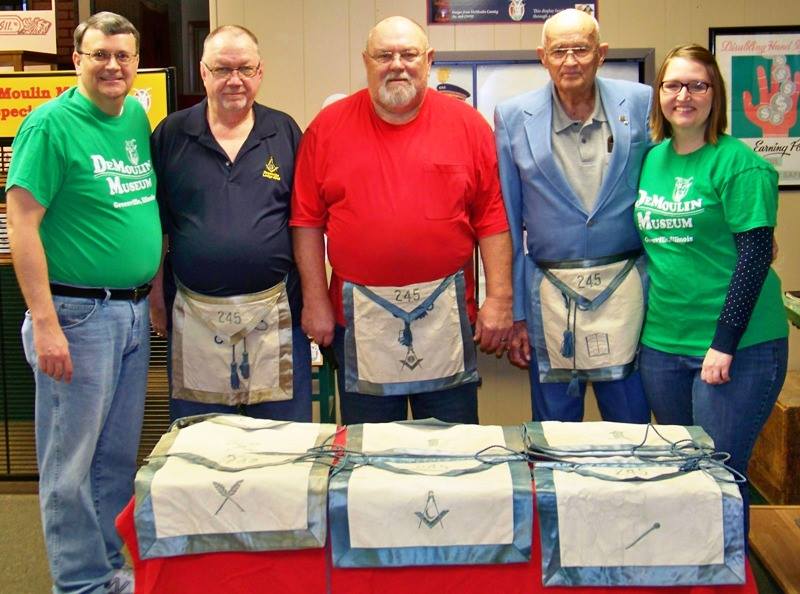 Bob Kirkman, Merle Scott, and Kenneth Henry of the Greenville Masonic Lodge, book-ended by John Goldsmith and Gina Lewis of the DeMoulin Museum.